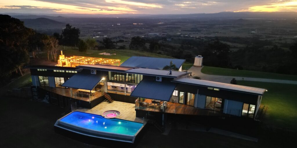 Stunning aerial view of Western Ridge Wedding Venue estate at sunset, Brisbane countryside