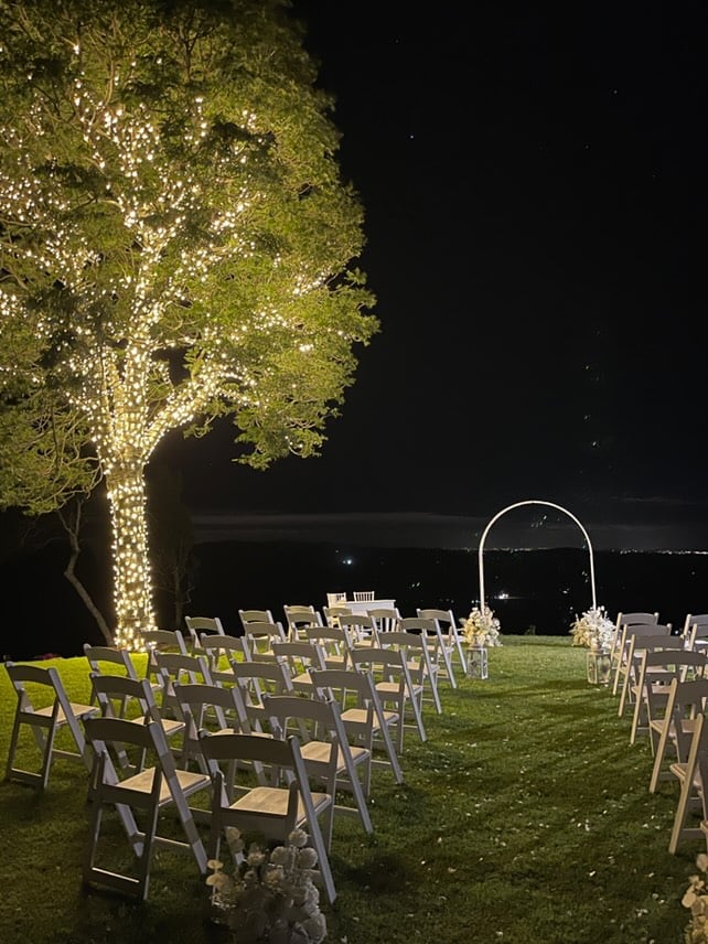 Outdoor wedding ceremony under a fairy-lit tree at Western Ridge Wedding Venue, Brisbane